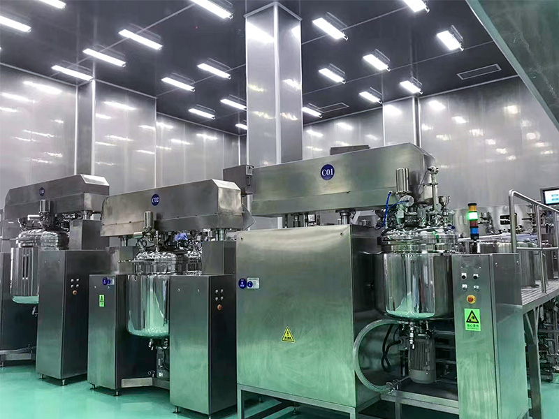 Industrial stainless steel reactor and nutsche filter dryer setup in a cleanroom environment.